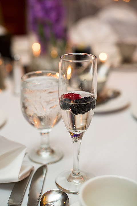 Red wine and water glasses on a reception table
