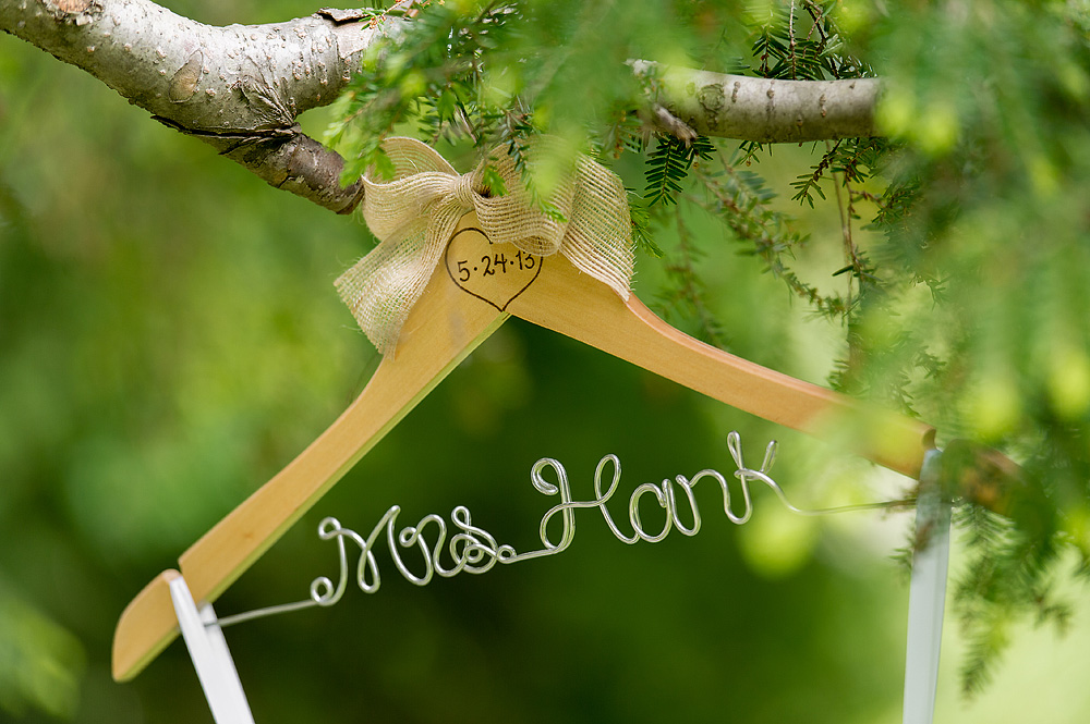 Personalized bridal hanger suspended from a tree branch