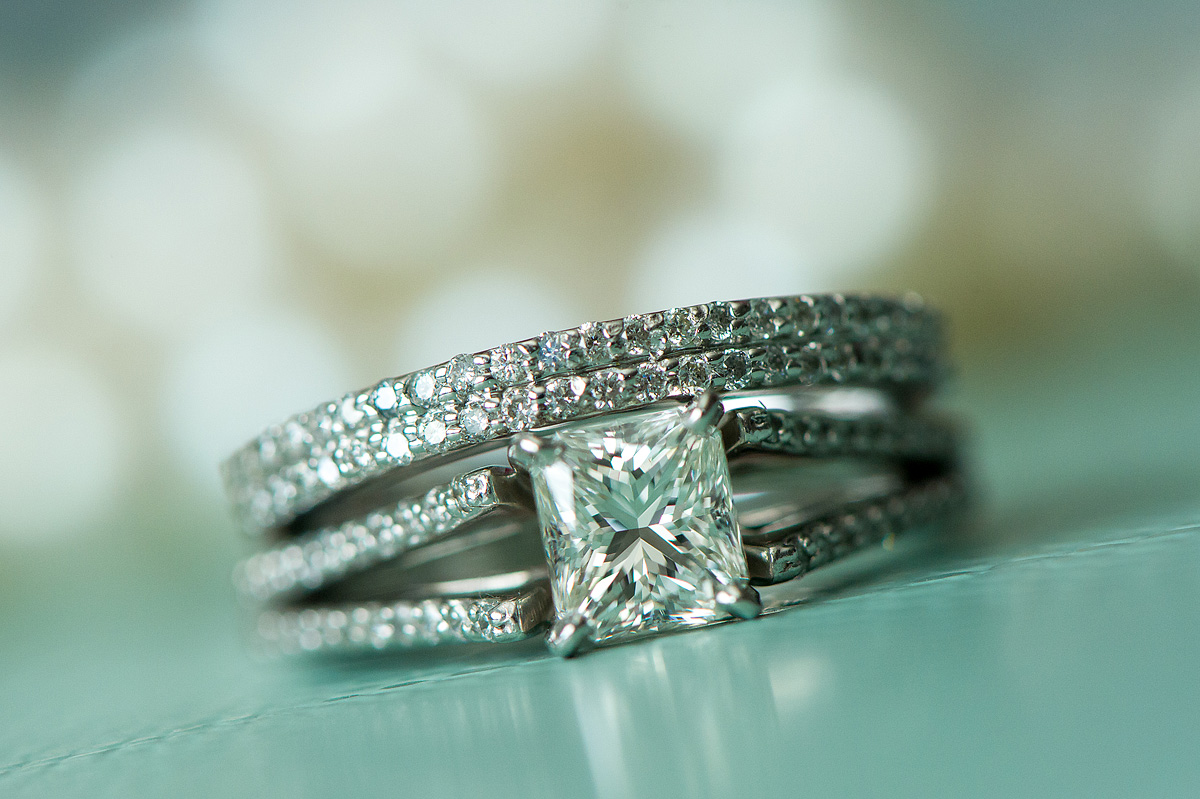Princess-cut engagement ring with diamond wedding bands