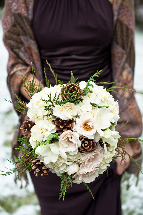 Ivory rose and evergreen winter bridal bouquet
