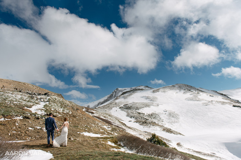 29 bride groom walking up mountain(pp w768 h511) - Rachel + Nic | Loveland Pass Colorado Wedding Photos