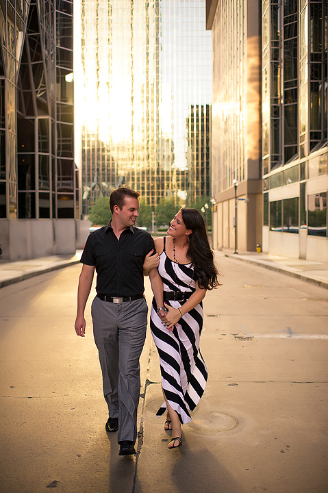 Couple walking beside a downtown Pittsburgh building