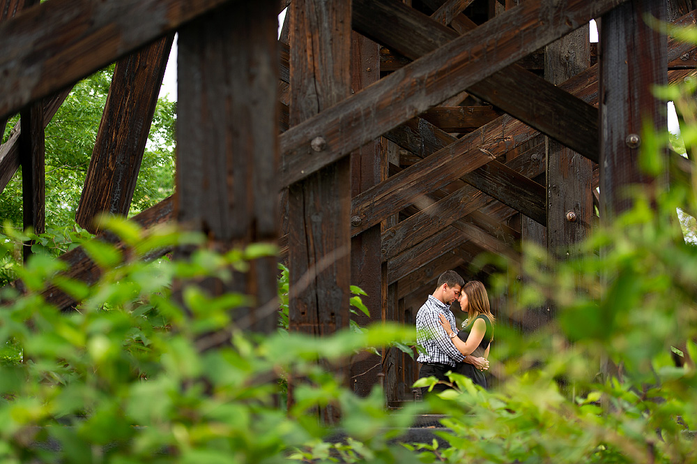Couple seated beneath a weathered wooden structure