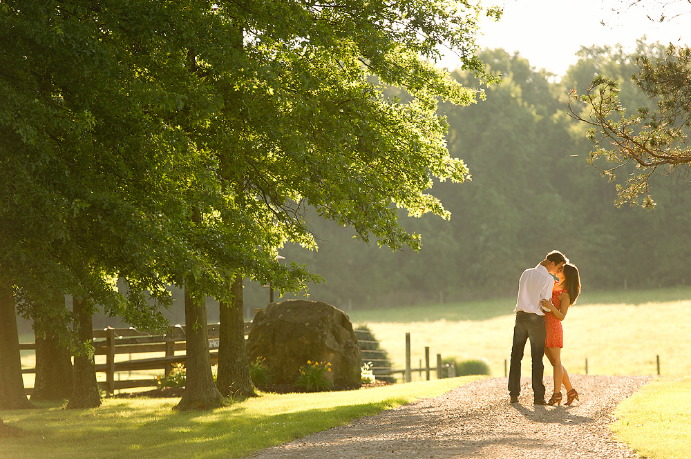 Couple embracing on a sunlit country lane