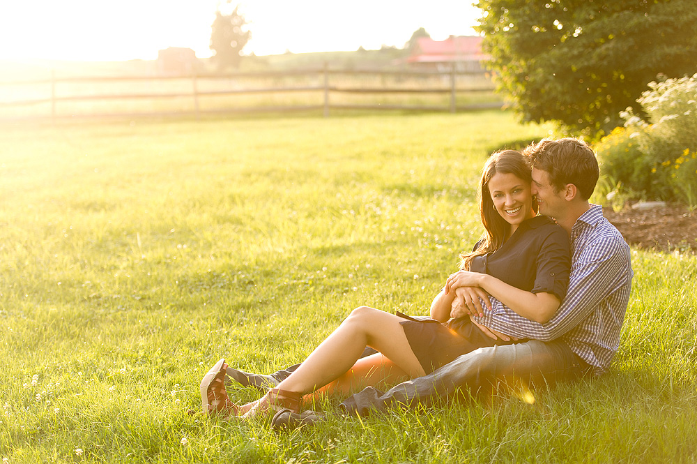 Couple seated together in a sunlit field