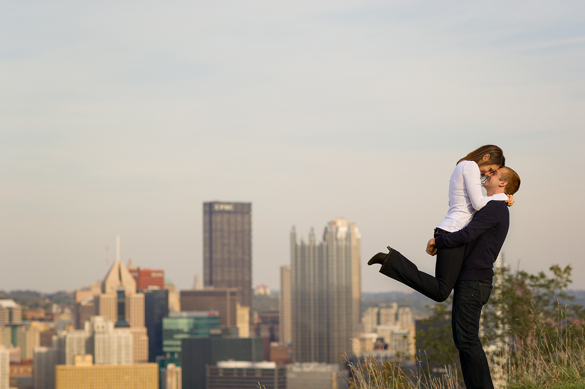 Couple embracing at the Mount Washington overlook above the Pittsburgh skyline