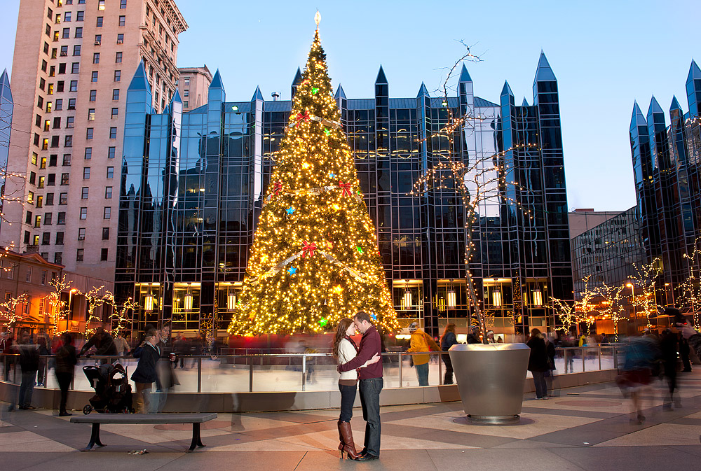 Couple beneath the Christmas tree at PPG Place in Pittsburgh