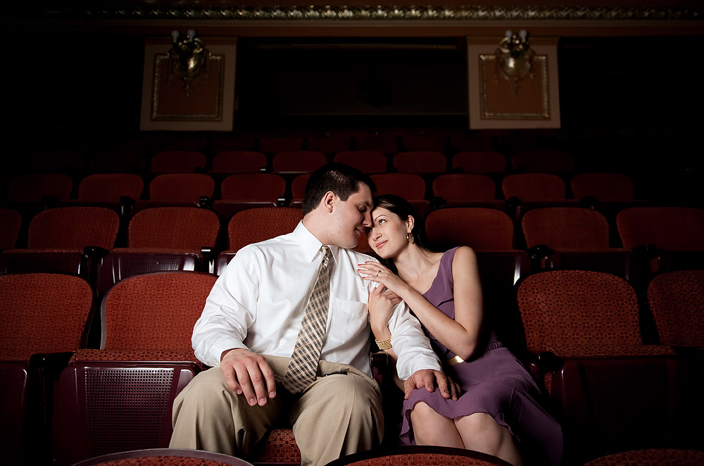 Couple seated together in theater seats