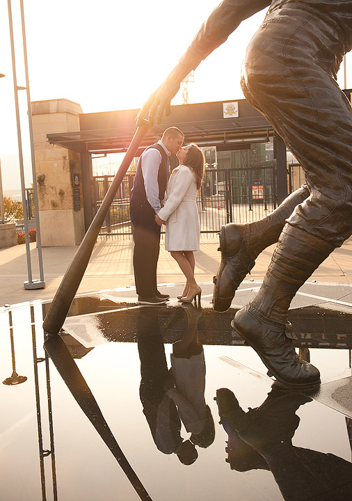 Couple reflected in mirrored public art along the Pittsburgh riverfront