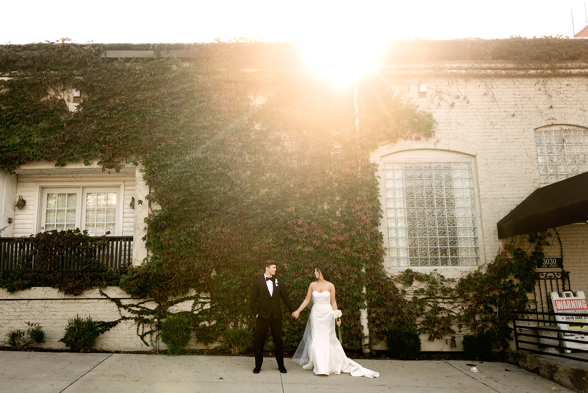 Wedding couple outside J. Verno Studios in evening light