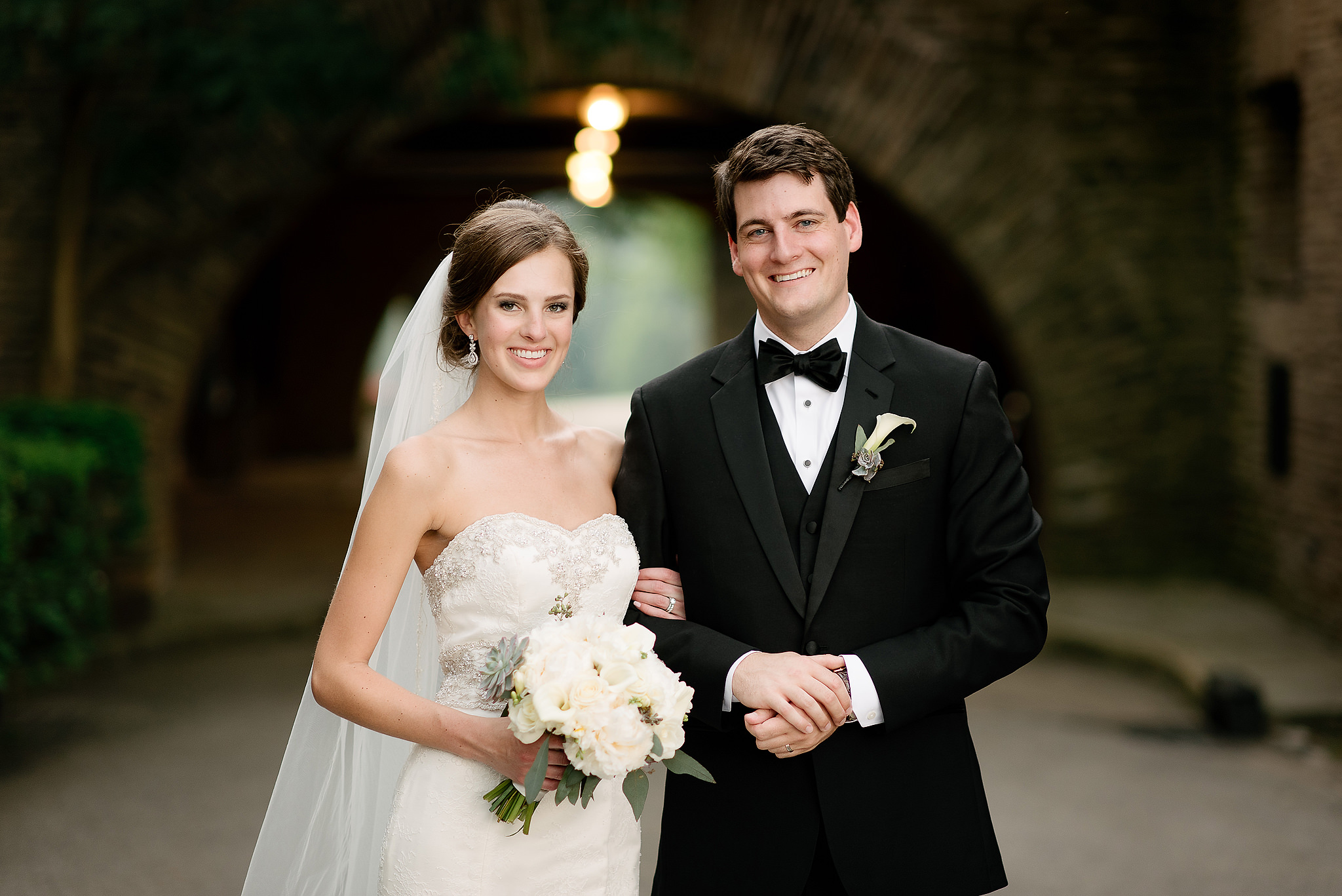 Bride and groom posing in formal attire at Longue Vue Club