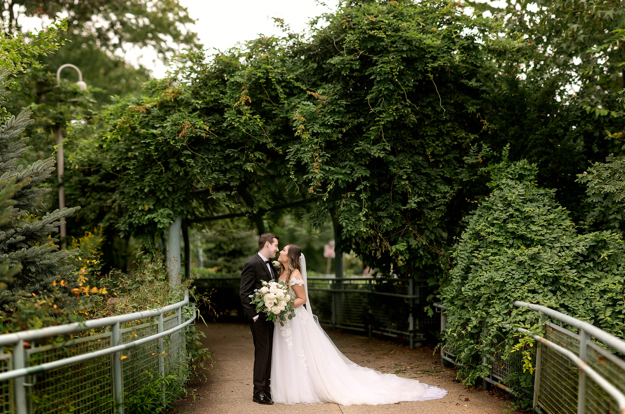 Wedding couple on the vine-covered walkway at Pittsburgh's West End Overlook
